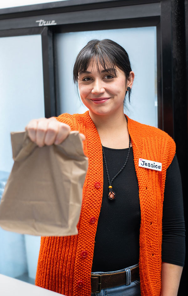 Woman holding lunch bag