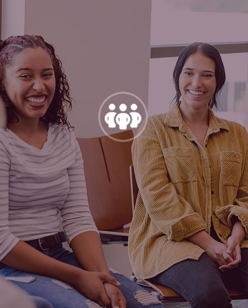 Women smiling in group setting