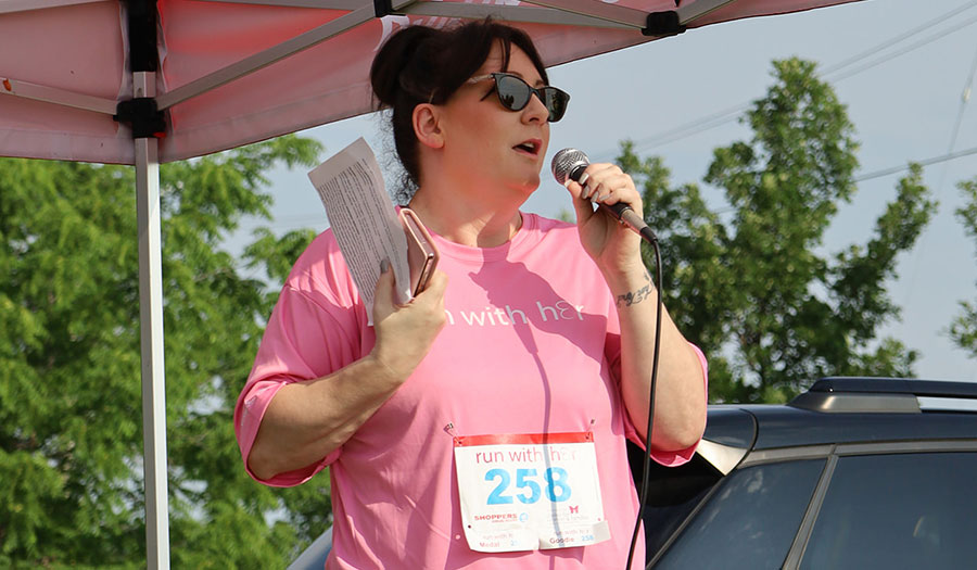 Woman on microphone at event